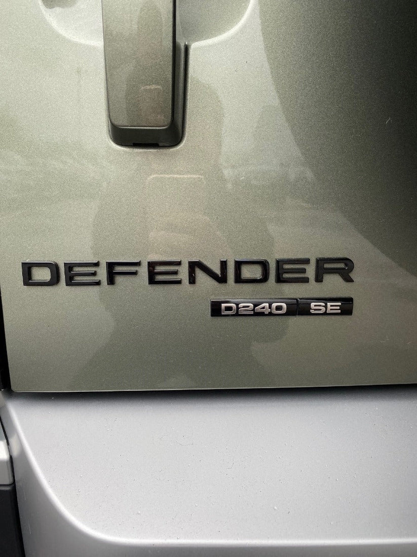 Land Rover Defender Rear Badge - Gloss Black – Stratstone Shop